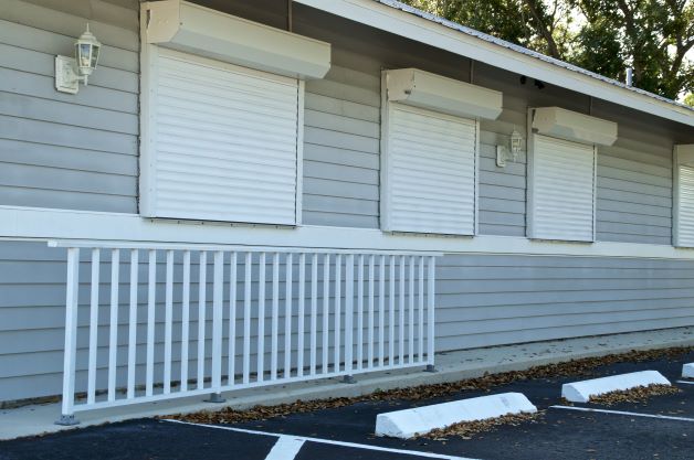 Building with white shuttered hurricane windows