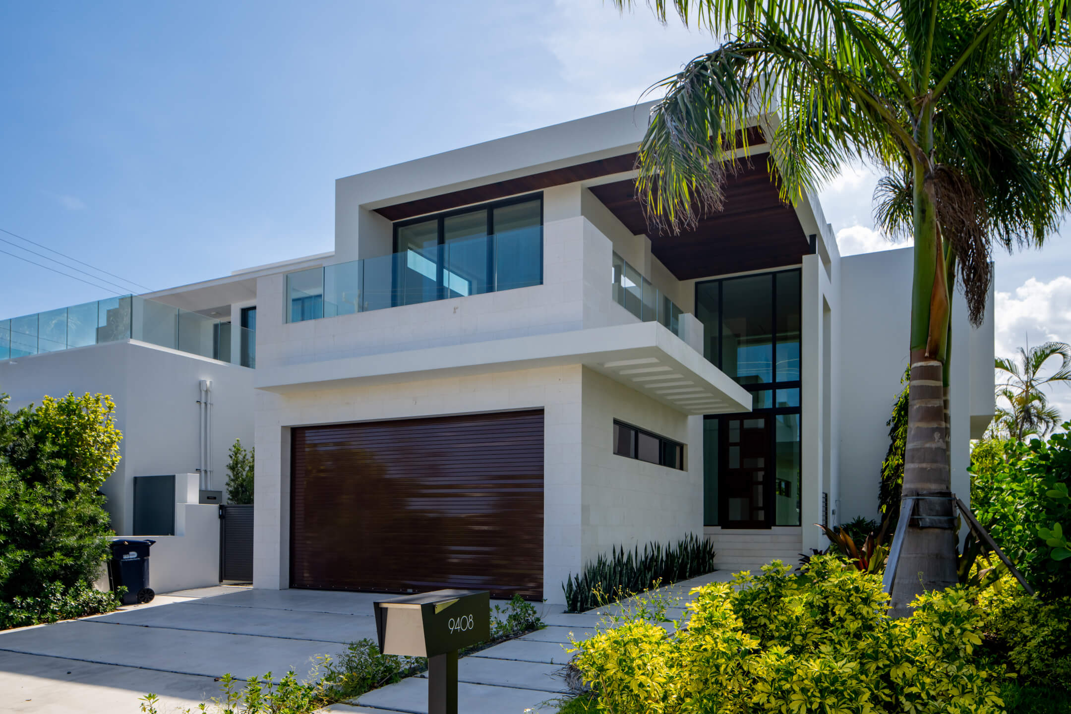 Residential building exterior with impact-resistant windows in South Florida