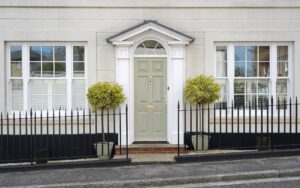 Exterior of a beautiful old town house with windows and front entry details