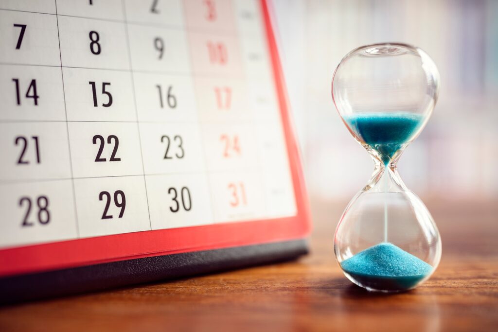 Calendar and hourglass representing repair or installation timeline