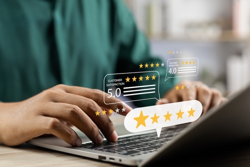 Customer posting a five-star online review for a window installation company
